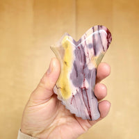 Jasper gua sha to massage facial pressure points